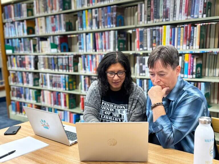 Frances and Mycal work remotely from their local library.