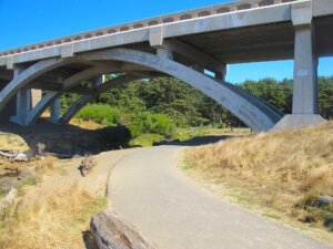 Paved beach access trail under Spencer Creek Bridge at Beverly Beach